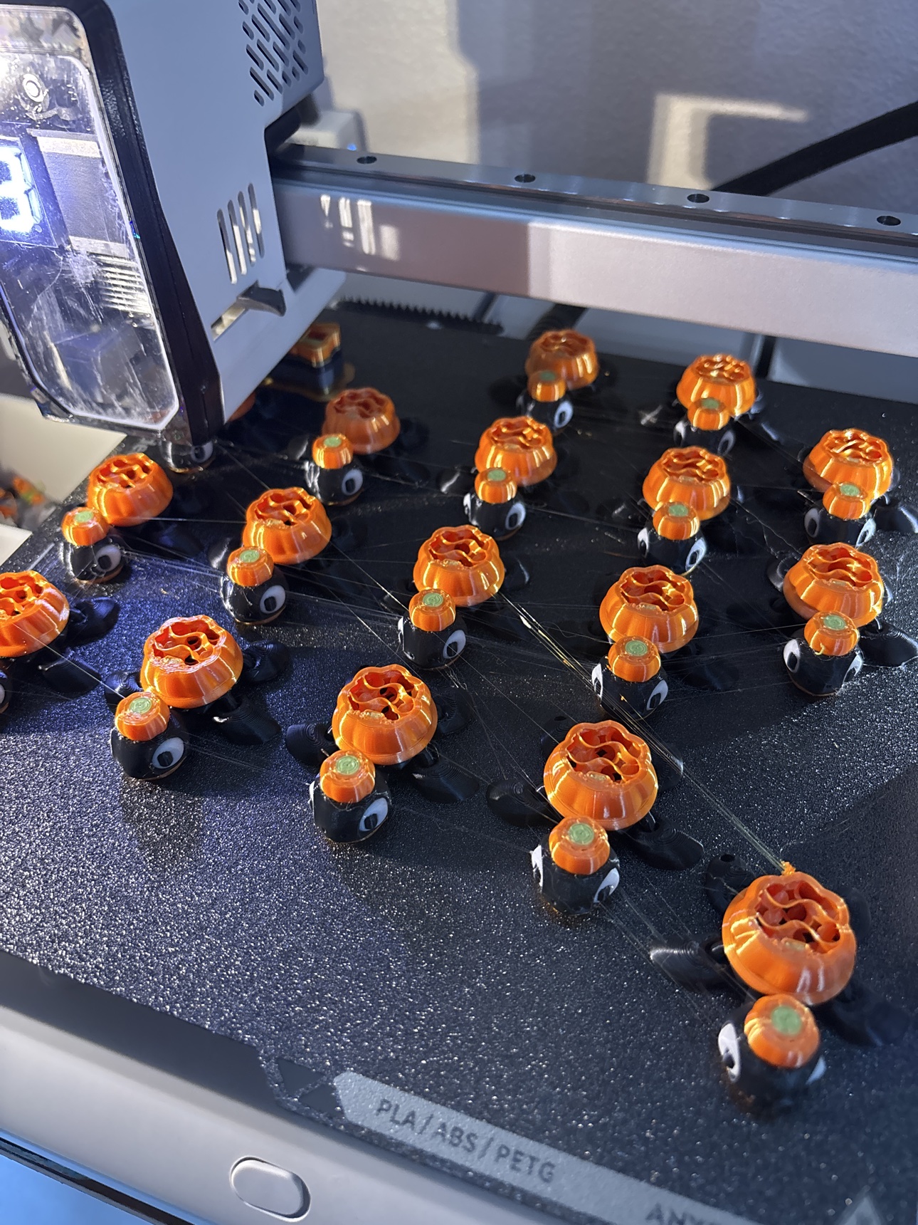 Halloween pumpkin mini flexi toys printing on a 3D printer